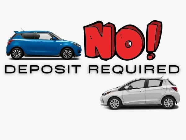 suzuki swift and toyota yaris parking next to a sing says no deposit reqired 